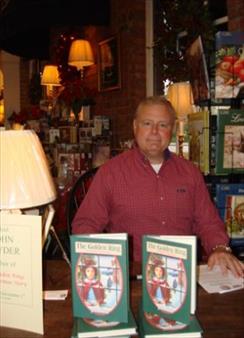 Image: Author John Snyder at a book signing.